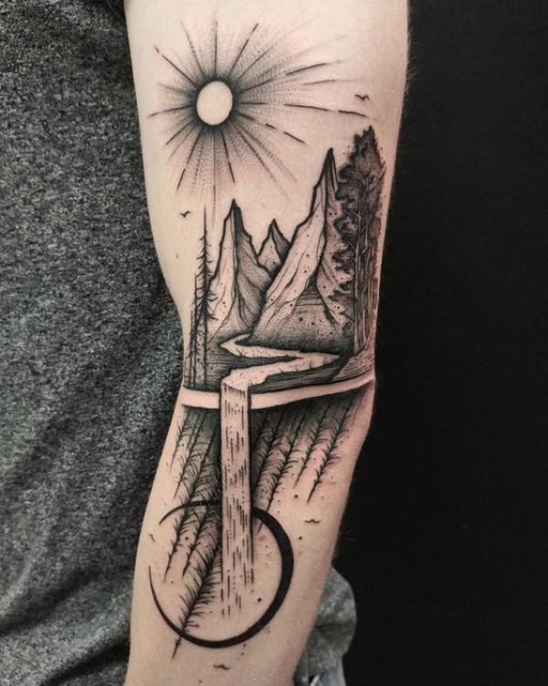 Sun and mountain landscape tattoo
