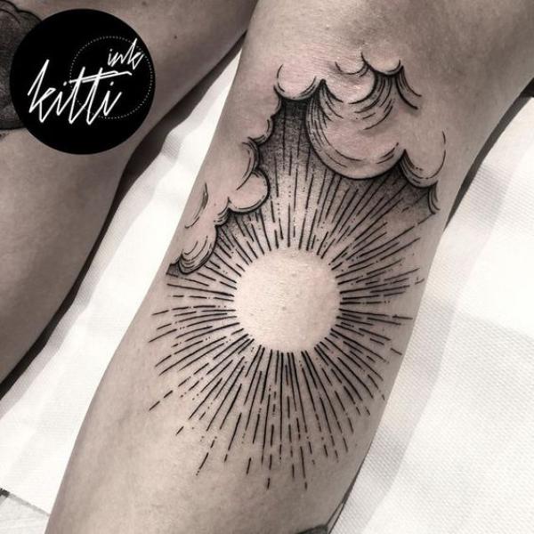 Sun below knee tattoo
