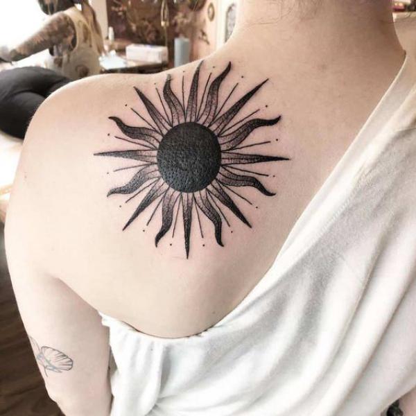 Sun shoulder blade tattoo