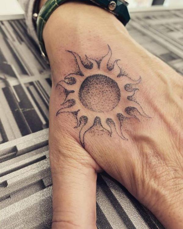 Sun thenar web space tattoo