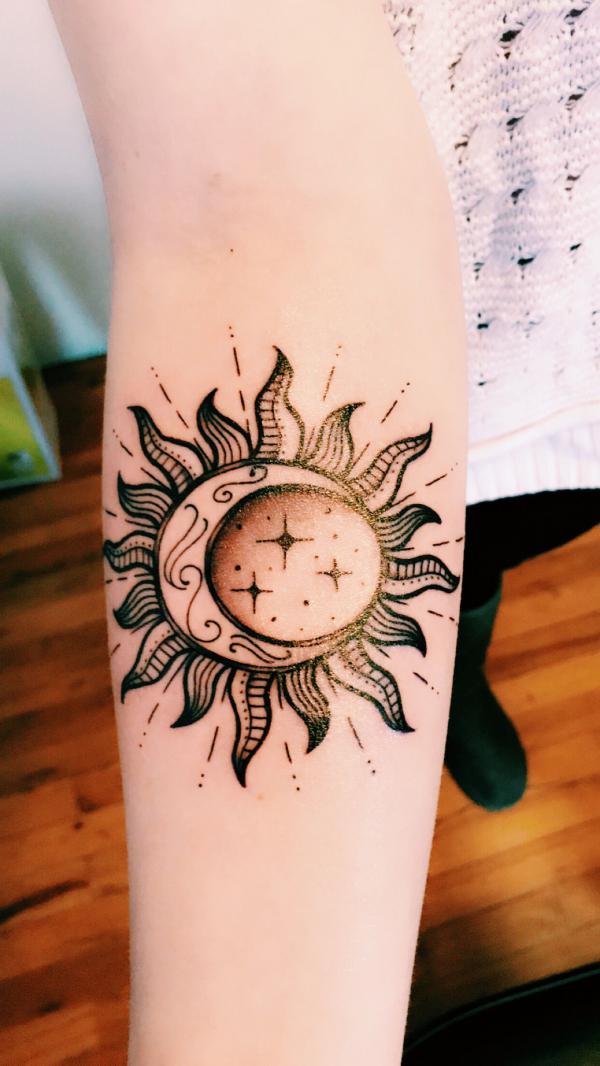 Sun with moon and stars tattoo