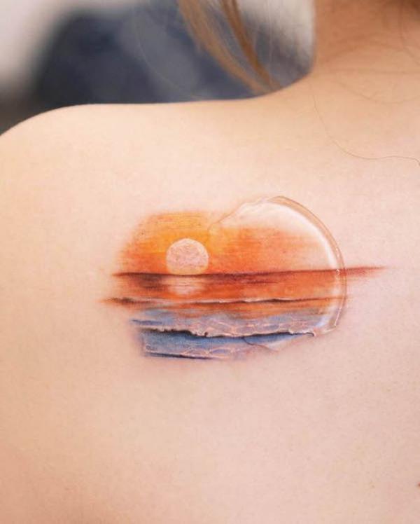 Sunset shoulder blade tattoo watercolor