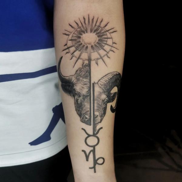 Taurus and capricorn with sun and moon tattoo