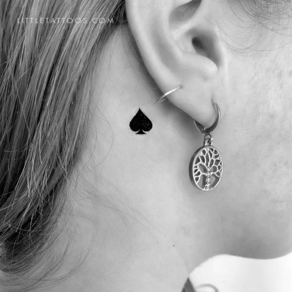 Tiny Ace of spade tattoo behind ear