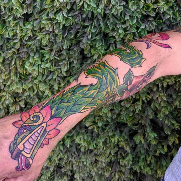Traditional Quetzalcoatl forearm tattoo