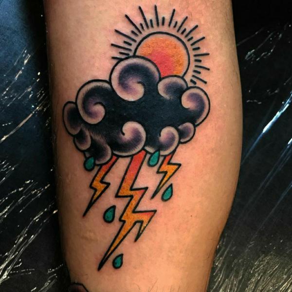 Traditional sun and cloud with lightning bolt tattoo