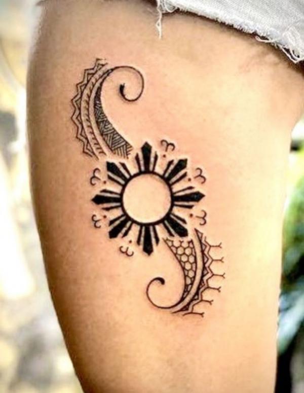 Tribal sun tattoo
