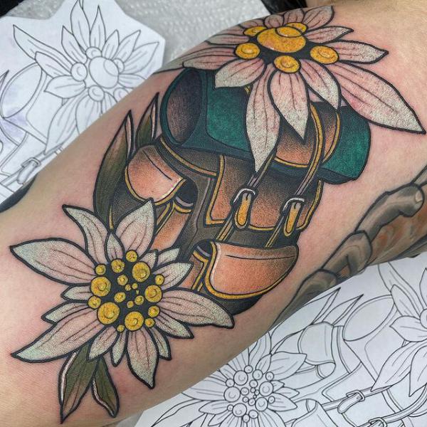 Two edelweiss flowers and bag tattoo