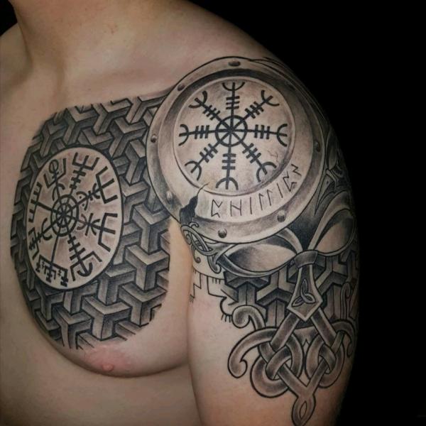 Viking shield tattoo on shoulder and chest