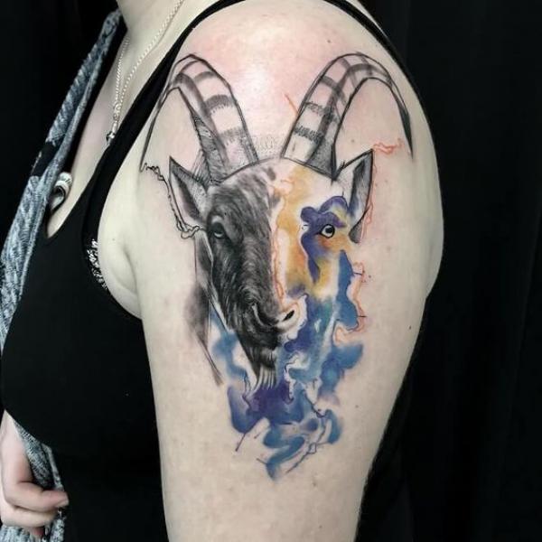 Watercolor Capricorn goat tattoo upper arm