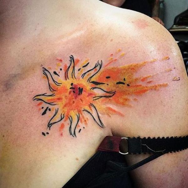 Watercolor sun chest tattoo