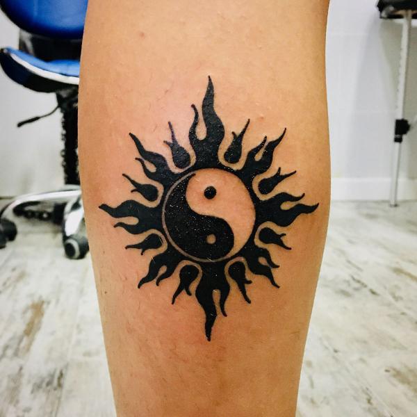 Yin Yang sun calf tattoo