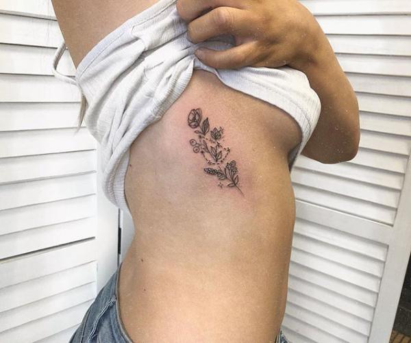 capricorn flower with constellation side tattoo