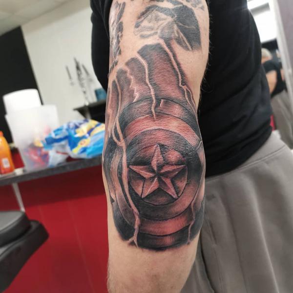 captain america shield tattoo elbow