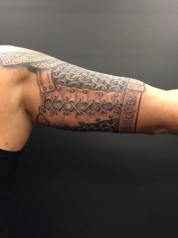 chainmail shield upper arm tattoo