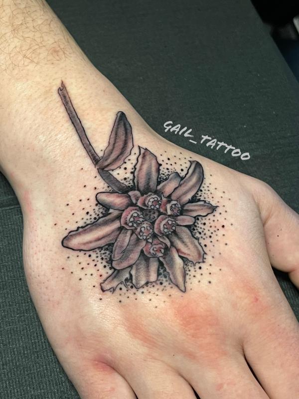 edelweiss hand tattoo