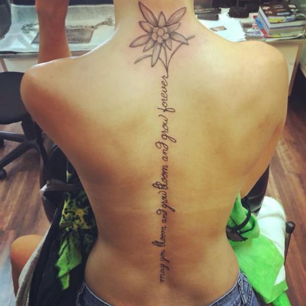 edelweiss spine tattoo with words may you bloom and grow bloom and grow forever
