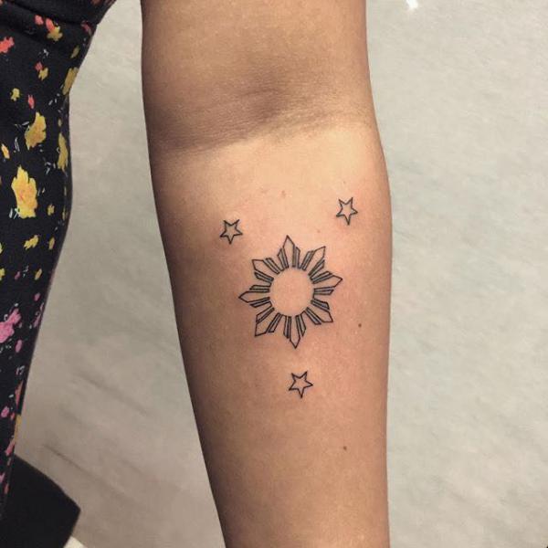 filipino sun with three stars tattoo