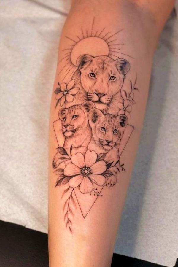 lioness and cub with flowers and sun tattoo