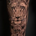 lioness and cub with flowers tattoo