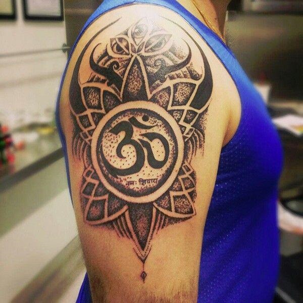 mandala om tattoo upper arm