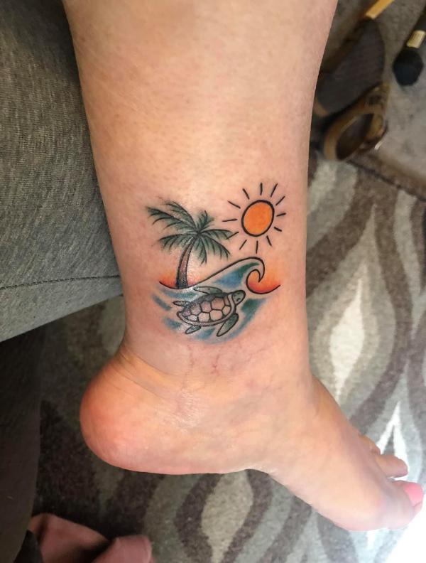 ocean sun and wave with palm tree and turtle tattoo