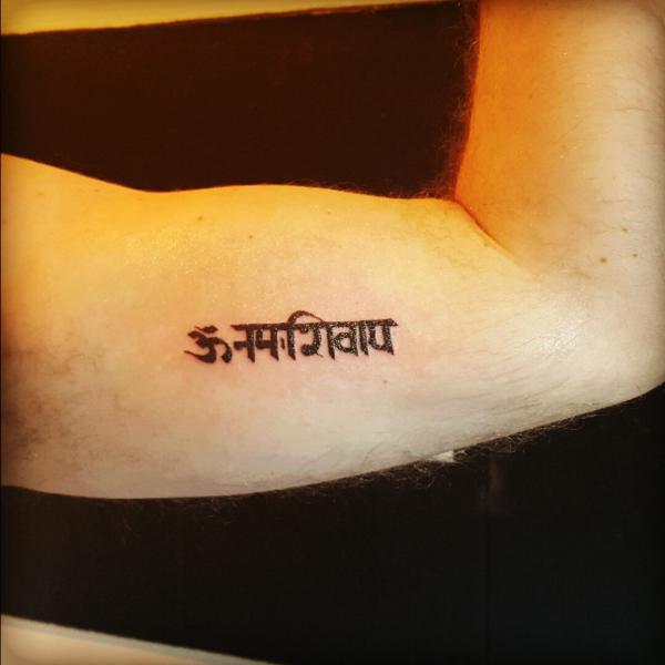 om namah shivaya tattoo bicep