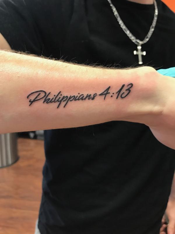 philippians 4 13 tattoo on outer forearm