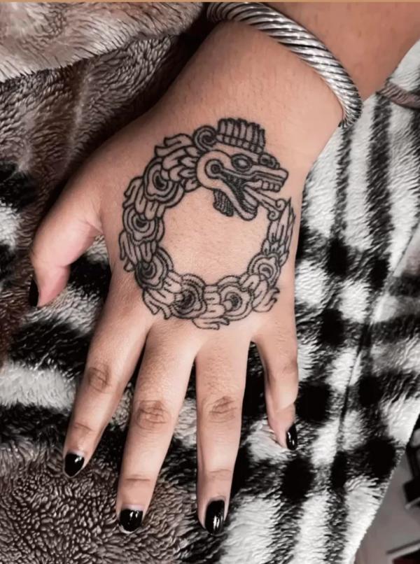 quetzalcoatl tattoo hand