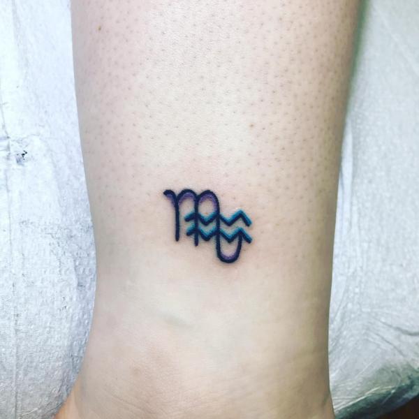 scorpio with aquarius glyph tattoo