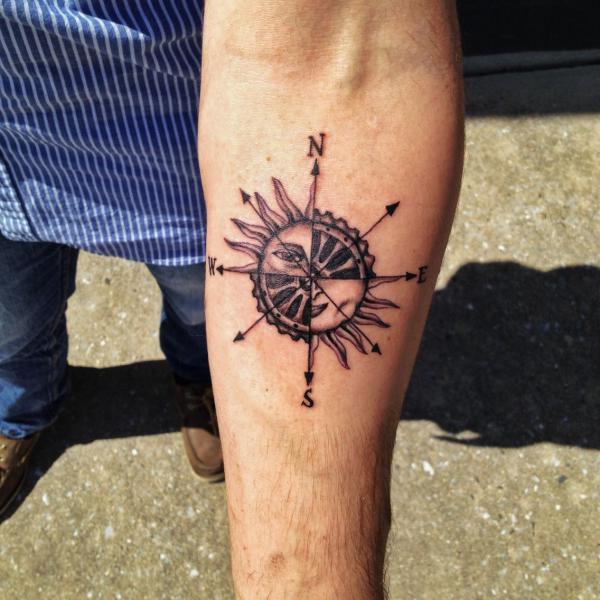 sun and compass tattoo forearm