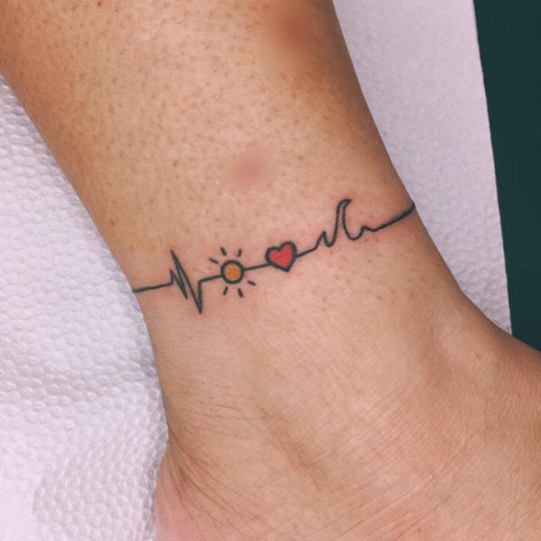 sun and heart and heartbeat tattoo