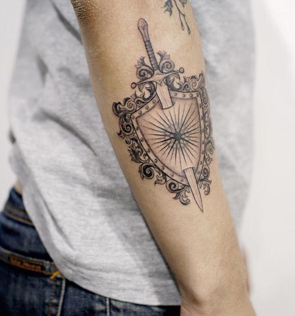 sword shield with sun tattoo