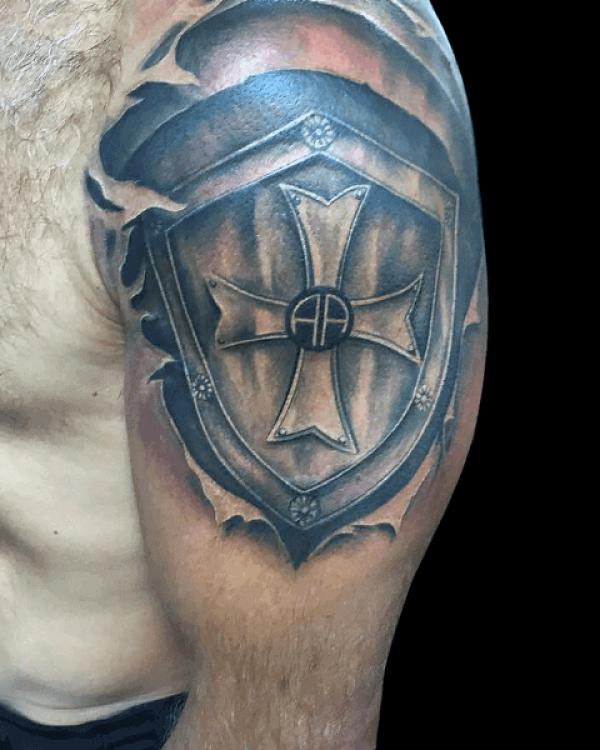 upper arm cross sheild tattoo