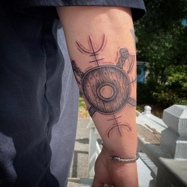 viking axe and shield tattoo forearm