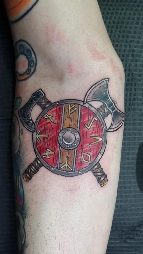 viking shield tattoo with axes