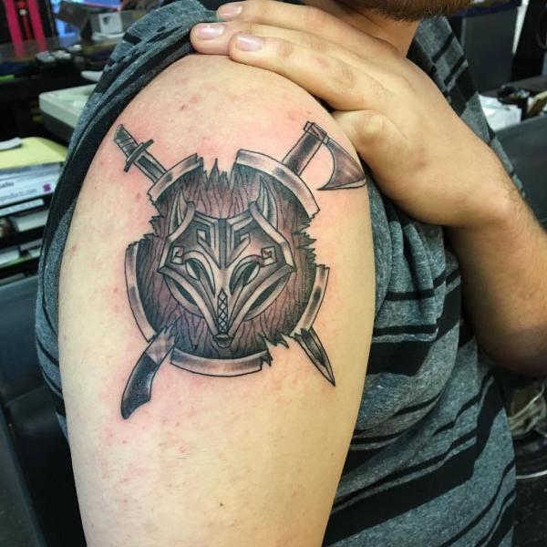 viking shield with sword and axe tattoo