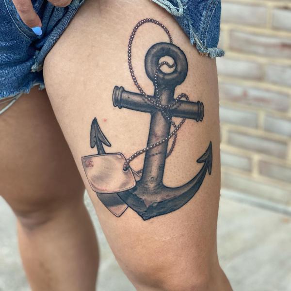 Anchor and dog tag tattoo thigh