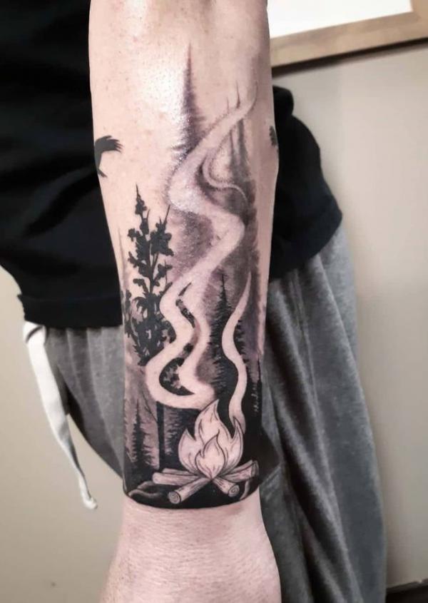 Black and white fire and forest tattoo forearm