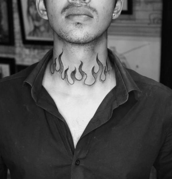 Black and white flame neck tattoo