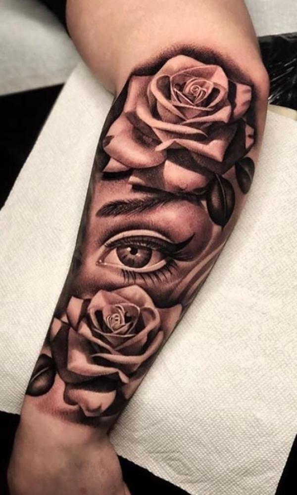 Black and white rose and eye tattoo forearm