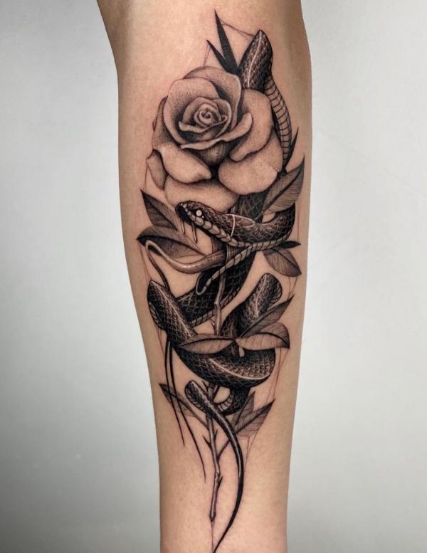 Black and white rose and snake tattoo