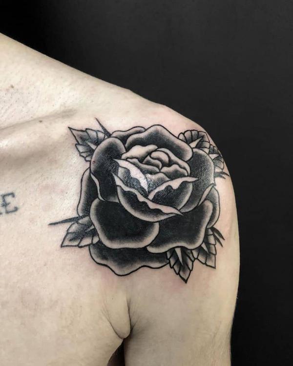 Black and white rose shoulder tattoo