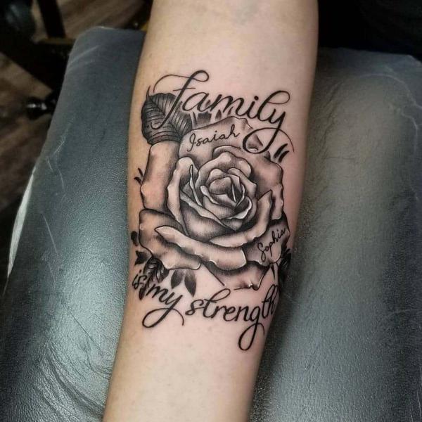 Black and white rose tattoo with quotes Family is my Strength