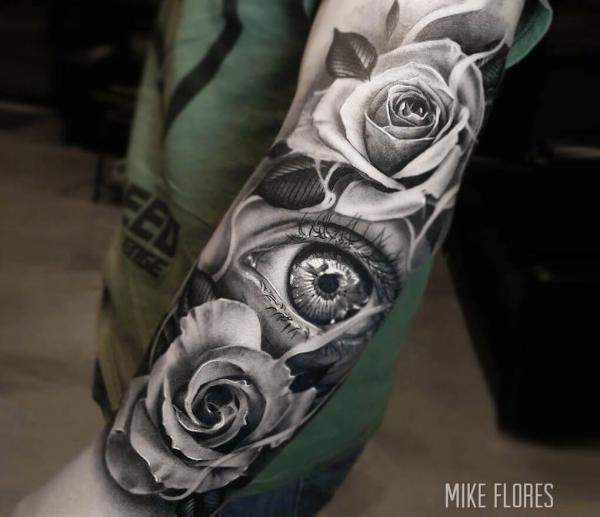 Black and white rose with realistic eye tattoo