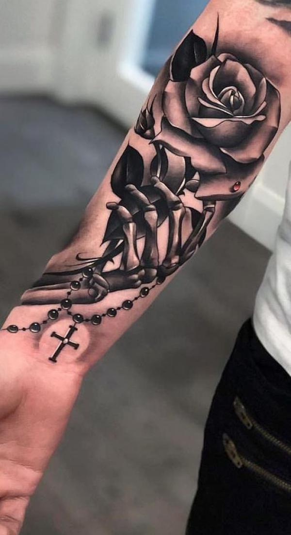 Black and white rose with skeleton hand tattoo