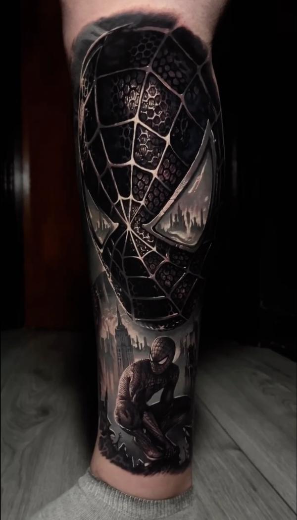 Blackout spider man tattoo on lower leg