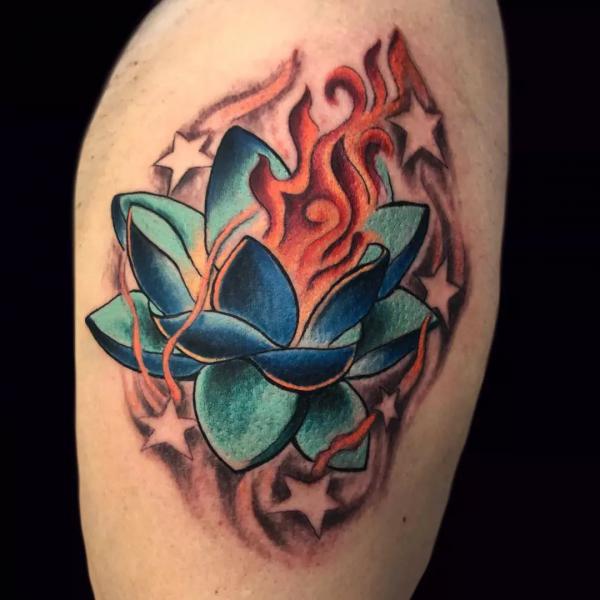 Blue lotus flower in flame tattoo
