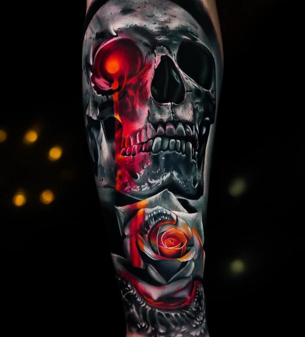 Dark Skull and rose with flame tattoo forearm