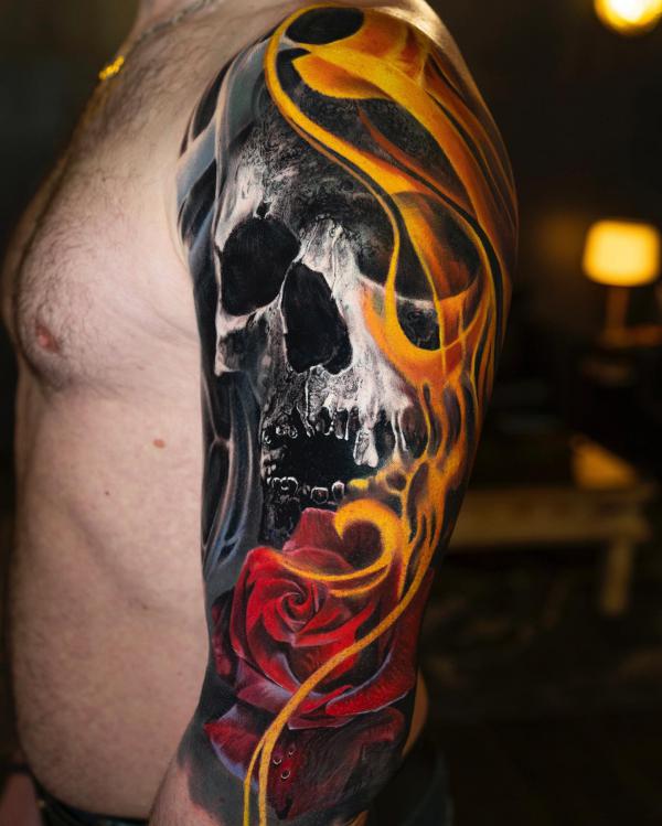 Dark skull and red rose with flame half sleeve tattoo